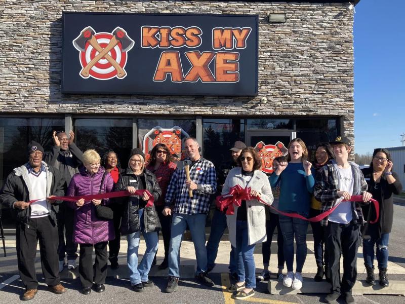 Kiss My Axe ribbon-cutting guests shown are Milford Mayor Archie Campbell, Vice Mayor Jason James, Ronnie Campbell, Jesse Hern, CCGM Vice President Debbie Millman, Angela Dorey, owners Scott Harris and Michelle Harris, Amanda Lee, Mackenzie Harris, Ada Lee, Cameron Harris and CCGM Secretary Joie Fe Morgan. SUBMITTED PHOTO